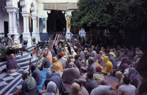 On a chilly morning during this year's festival, devotees hear a class on Srimad-Biragavaram in the temple courtyard.
