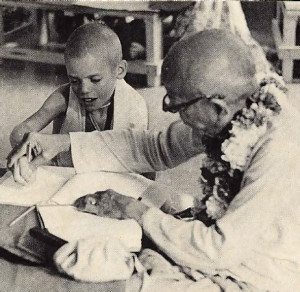 Dr. Hopkins remembers that "you could see (Srila Prabhupada) very consciously and patiently shaping people's devotional practices ." Here he shows Dvarakadhisa dasa how to form Sanskrit letters.