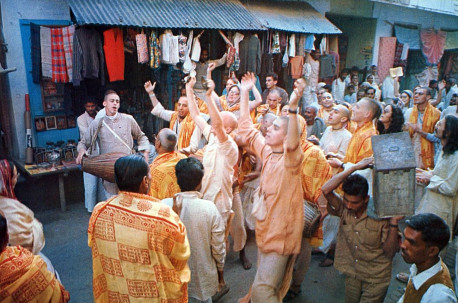 Devotees of the Krsna consciousness movement celebrate sankirtana - congregational chanting of the holy name of the Lord - in the streets of present-day Vrndavana.