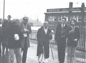 Depending upon Krsna: Srila Prubhupada and disciples walking on Hamburg's waterfront (1969). Sivananda is on the left, in front.