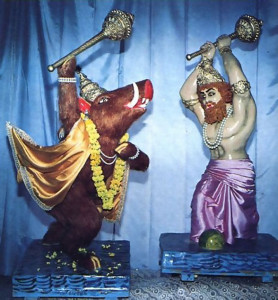 In a grimmer mood, the figures at right depict a scene from the Vedic scripture Srimad-Bhagavatam: the conflict between the incarnation of Krsna as a boar and the great demon Hiranyaksa.