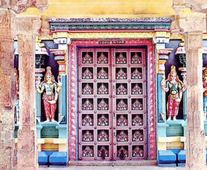 The main door of the temple is flanked by colorful reliefs.