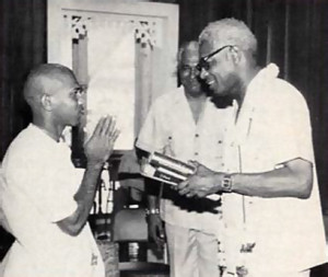 President Desmond Hoyte with Rupa Gosvami dasa and Suraj Narian (center).