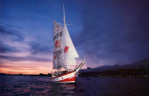 The lights of Waikiki and the pastels of dusk form a suitable backdrop for one of the Jaladuta II's sunset cruises